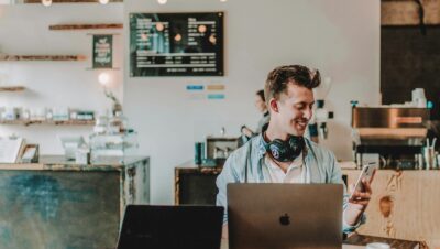 man using smartphone smiling