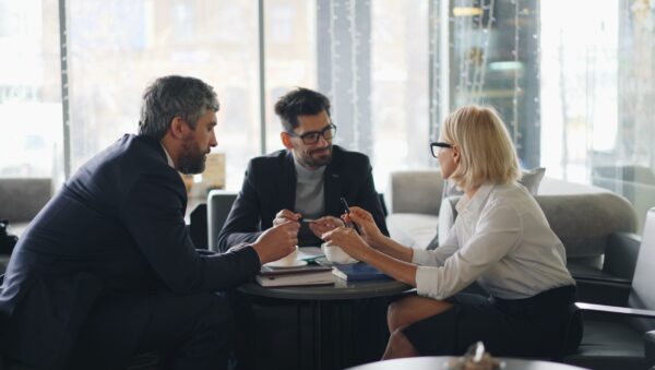 a group of people sitting around a table